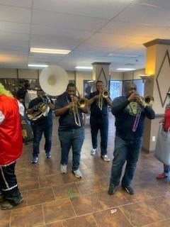 a group of musicians playing instruments in a room