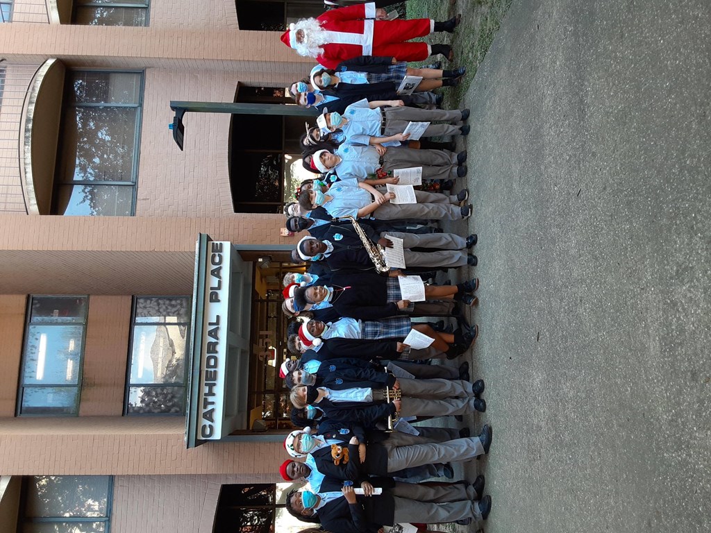 a long line of people standing outside of a building