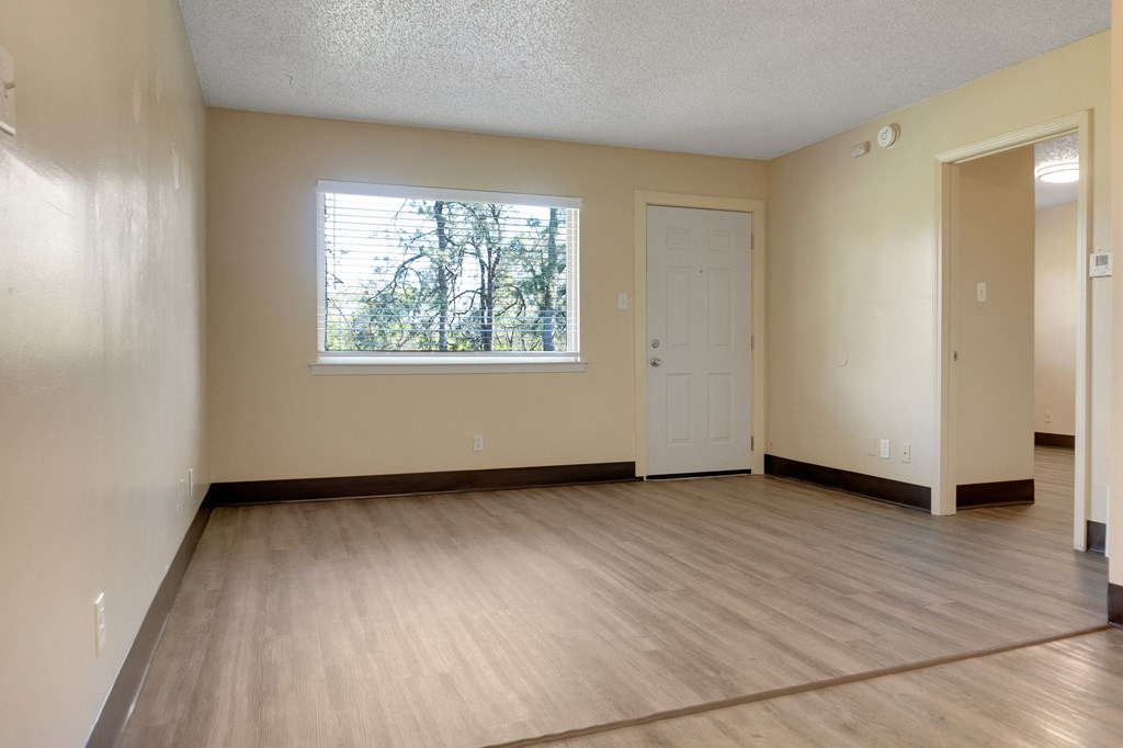 A room with a window and a door.