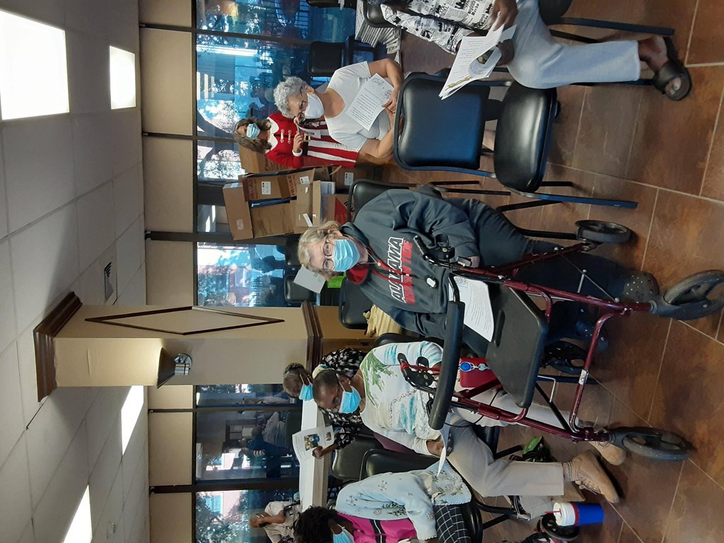 an aerial view of a group of people sitting in office chairs