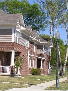 a row of houses on the side of a street