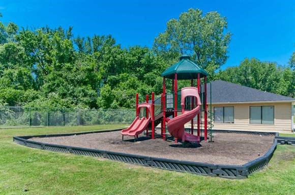 a playground with a set of slides and