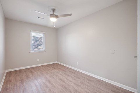 A Room With Ceiling Fan and Window at Fair Oaks Apartments, Little Rock, AR
