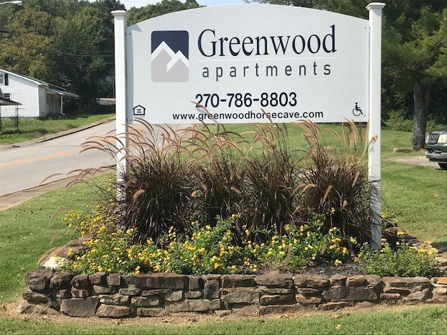 a sign on the side of a road