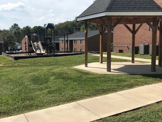 a park with a playground and a gazebo