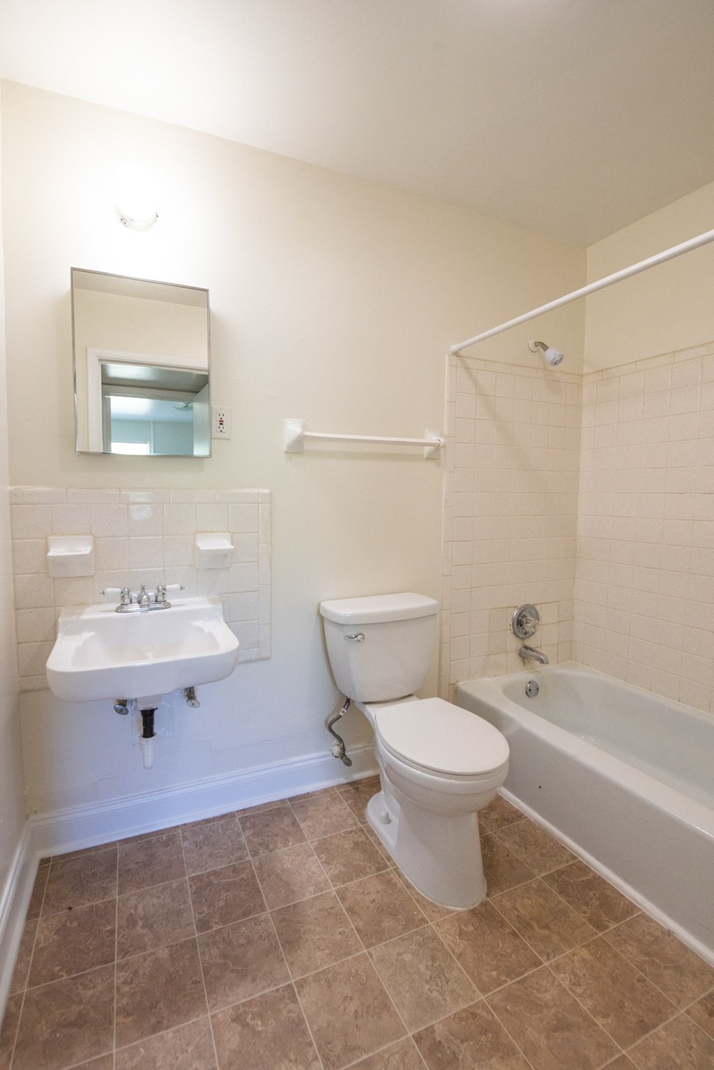 a bathroom with a toilet sink and bathtub