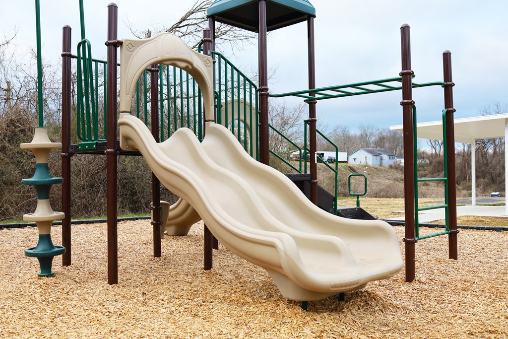 a slide on a playground at a park