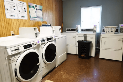 a row of washing machines in a laundromat
