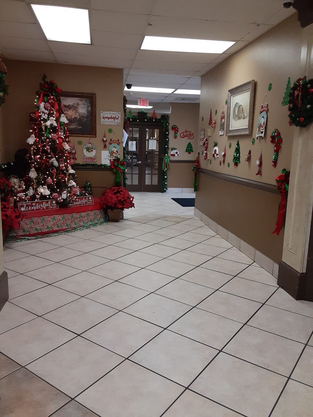 a christmas tree in the hallway of a building