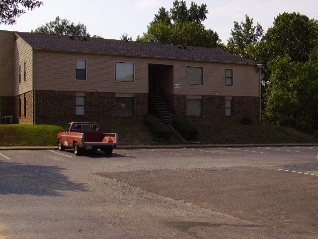 a red truck parked in front of a house