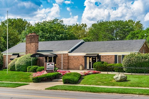 Brick rental office with flagpole and flower gardens at Northtowne Apartments, Columbus, OH
