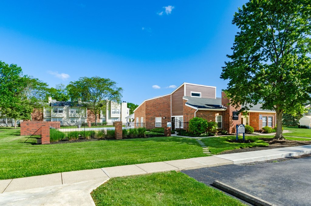 A residential area with houses and a tree.