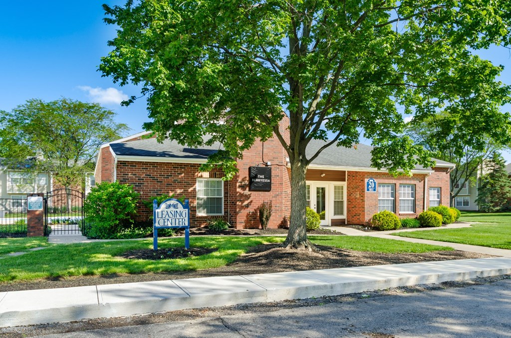 A brick building with a sign that says Leaside in front of it.