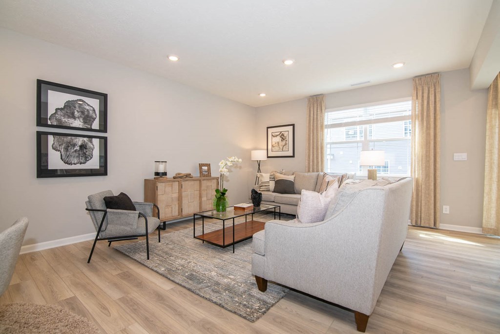 a living room with a couch and a chair at Jackson Run Townhomes, Indiana, 46075