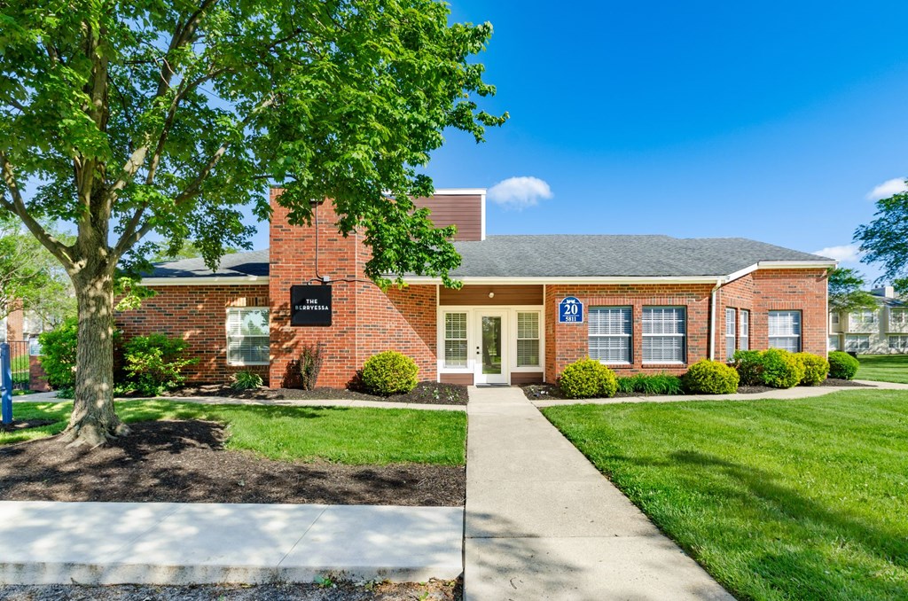 A building with a blue sign on the front door.
