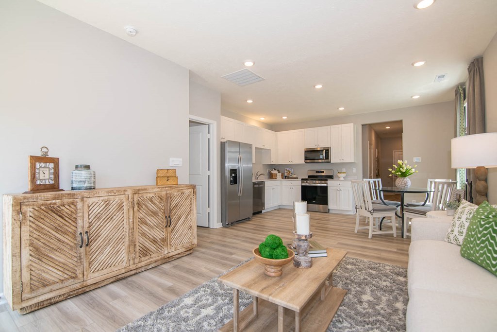 a living room with a couch and a table at Jackson Run Townhomes, Whitestown, IN
