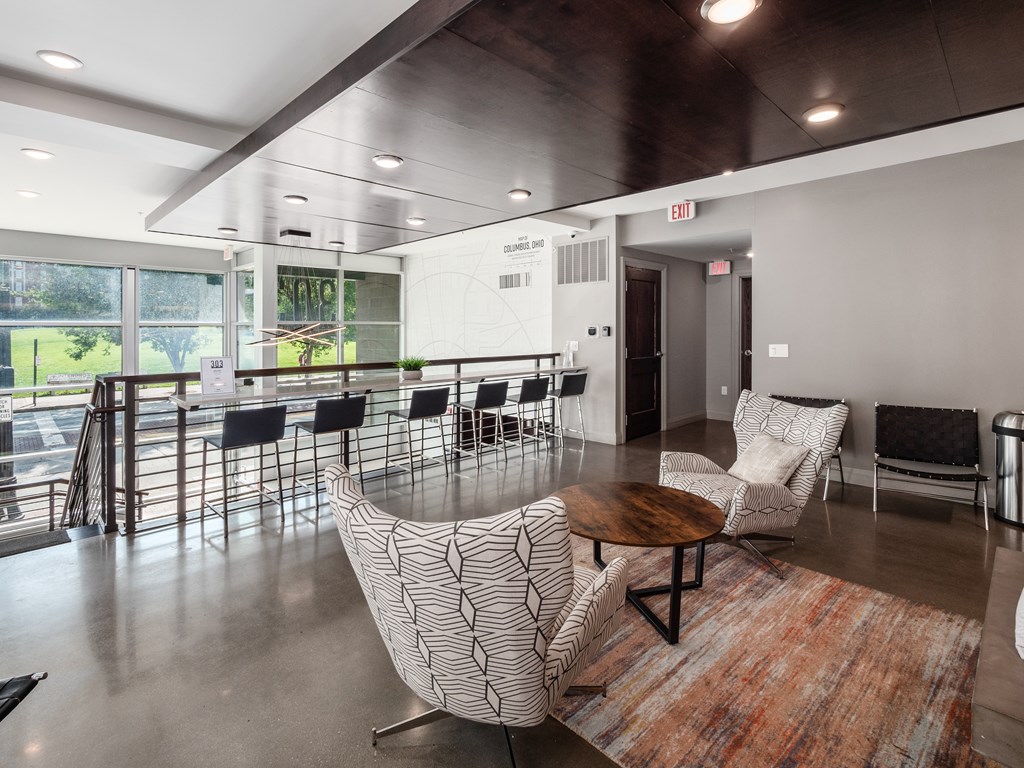 A conference room with a long table and chairs.