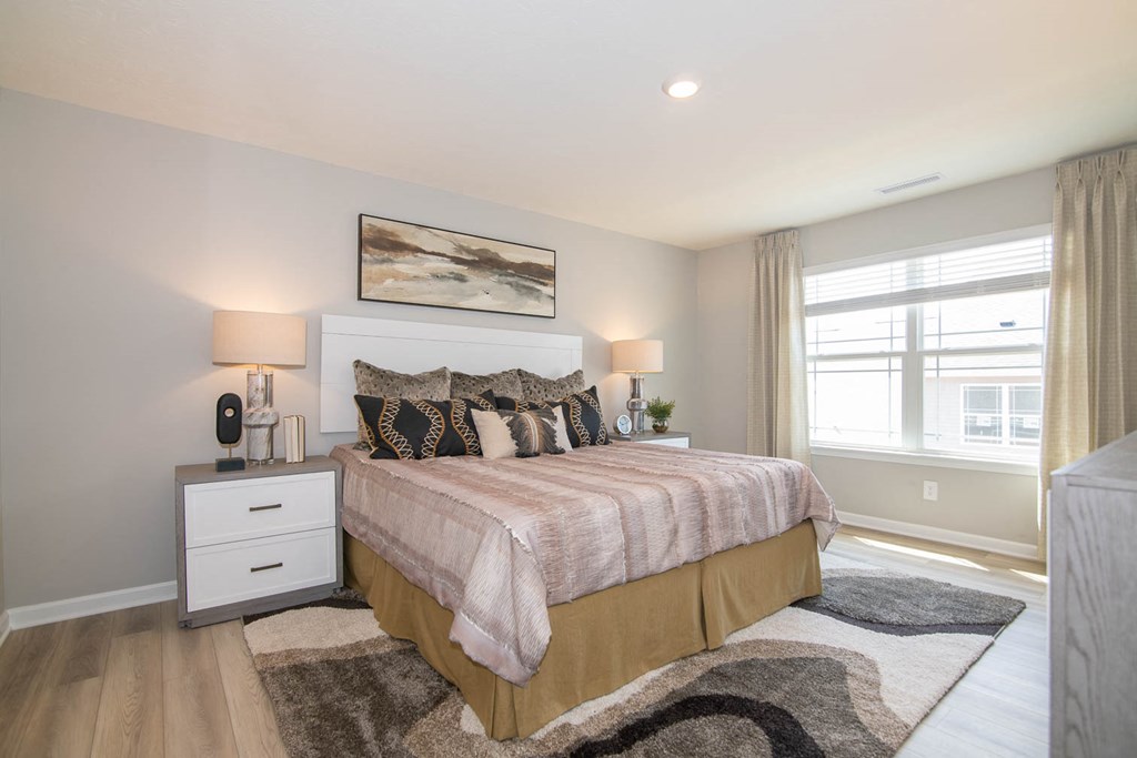 a bedroom with a bed and a window at Jackson Run Townhomes, Whitestown, 46075