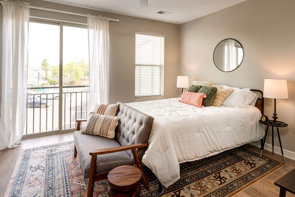a bedroom with a large bed and a window at Adelphi Quarter, Columbus, 43203