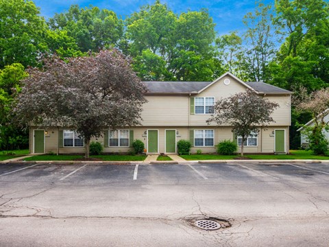 A building with a parking lot in front of it.
