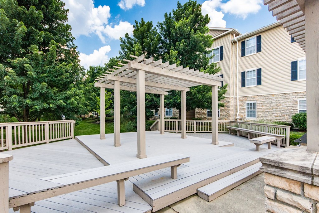 a picnic area with benches and a pergola on a deck at Prescott Place, Columbus, OH
