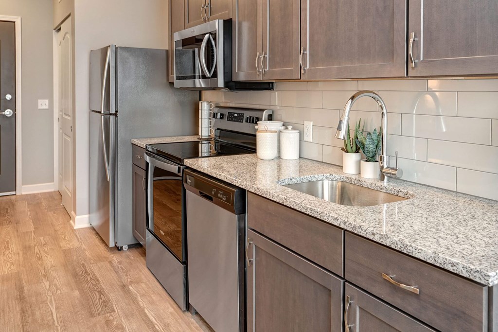a kitchen with stainless steel appliances and granite counter tops at Adelphi Quarter, Ohio