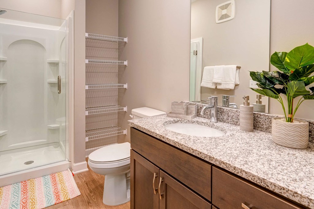a bathroom with a sink and a toilet and a shower at Adelphi Quarter, Columbus