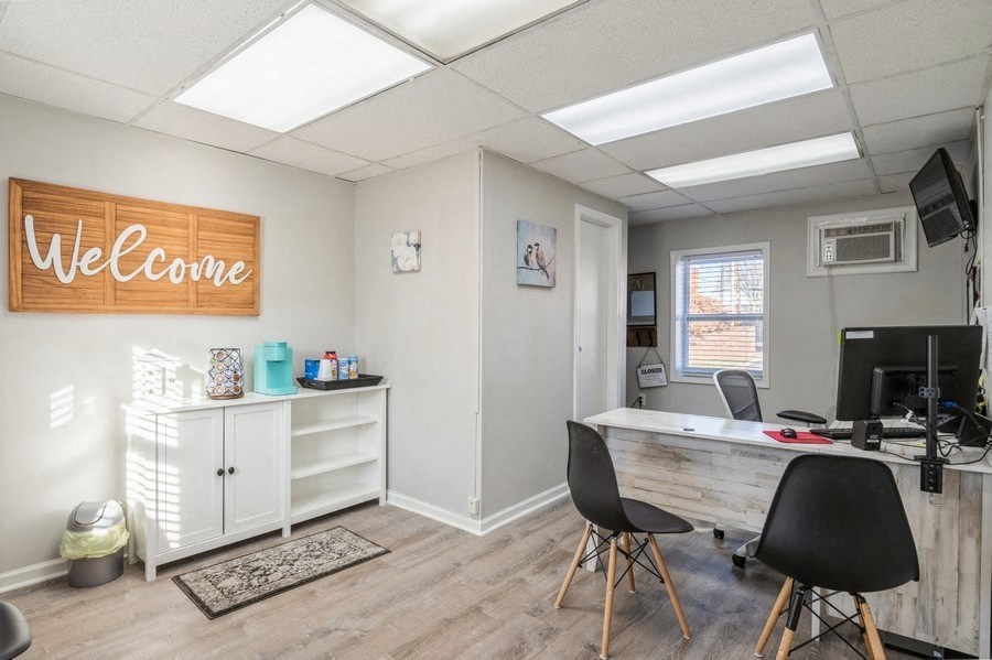 a home office with a desk and computer
