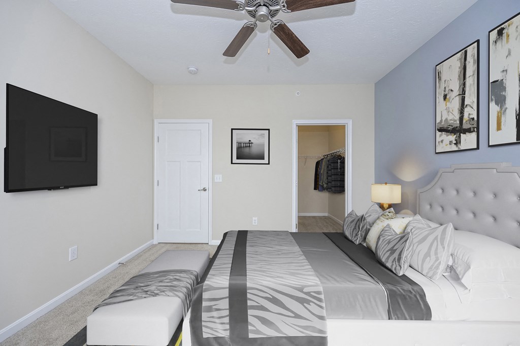 Bedroom with bed and a ceiling fan at Monmouth Row Apartments, Kentucky, 41071