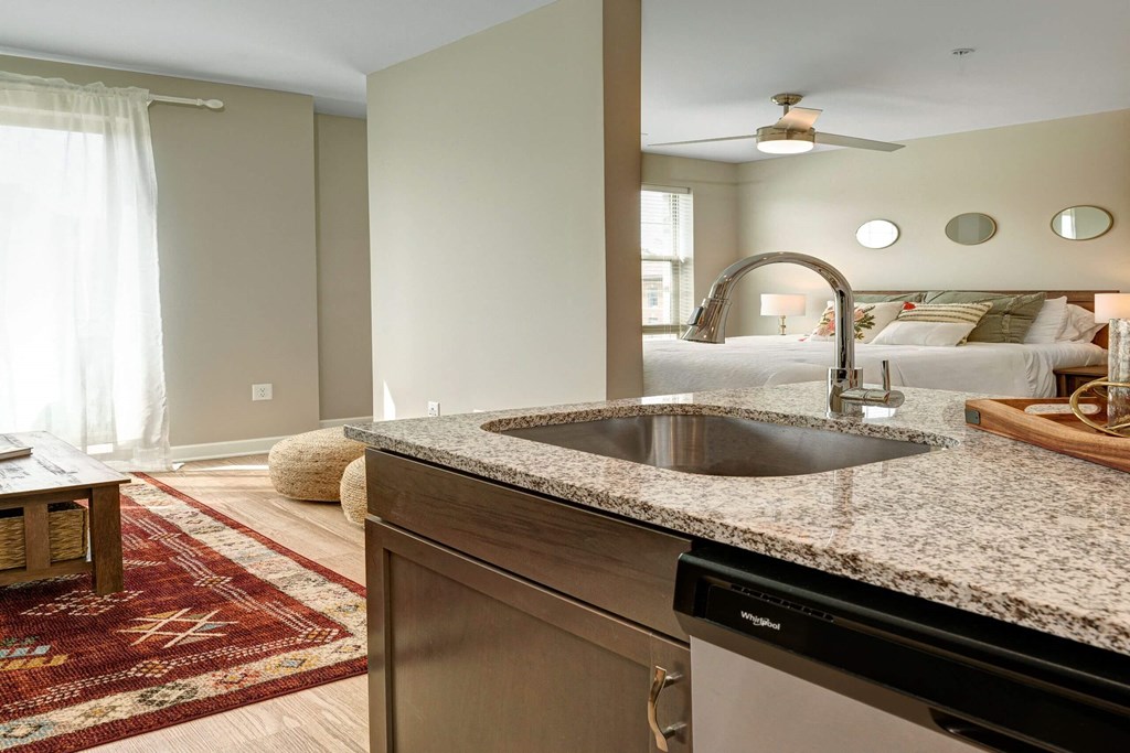 a kitchen with granite counter tops and a sink at Adelphi Quarter, Ohio