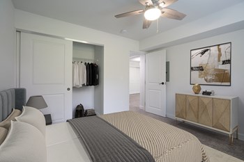 Bedroom with ceiling fan and lights at Stonecrest Apartments, Ohio - Photo Gallery 29