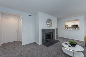Living room with a fireplace and a kitchen in the background  at Indian Lookout, Ohio, 45449