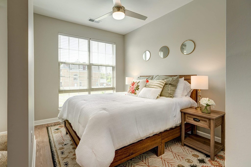 a bedroom with a large bed and a window at Adelphi Quarter, Columbus, Ohio