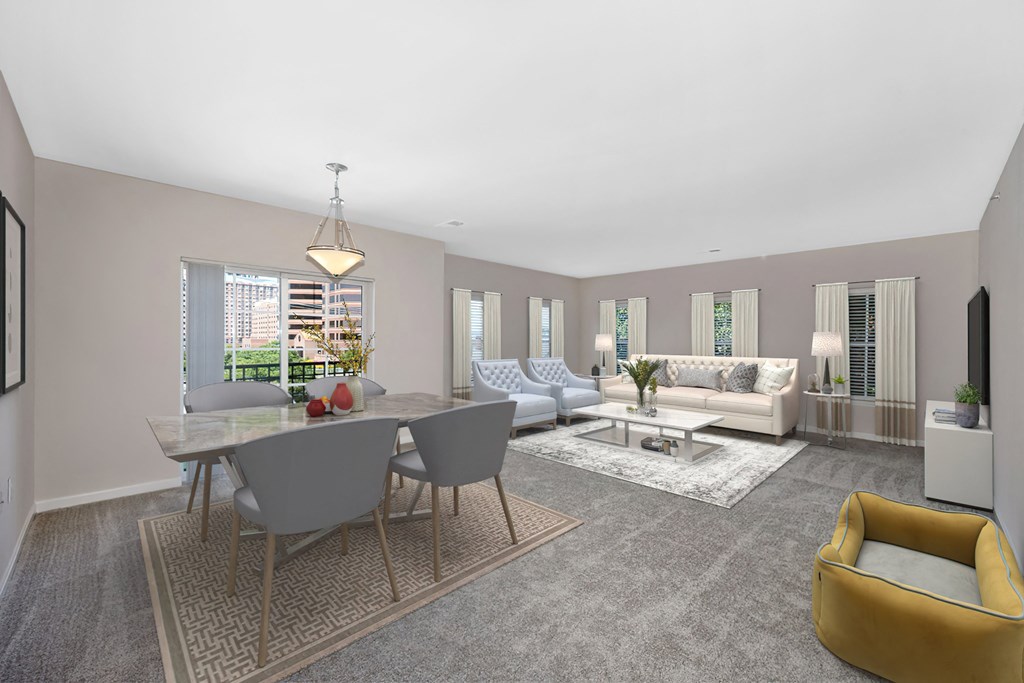 a living room with a table and chairs and a couch