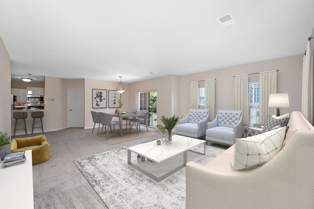 a living room with couches and chairs and a table