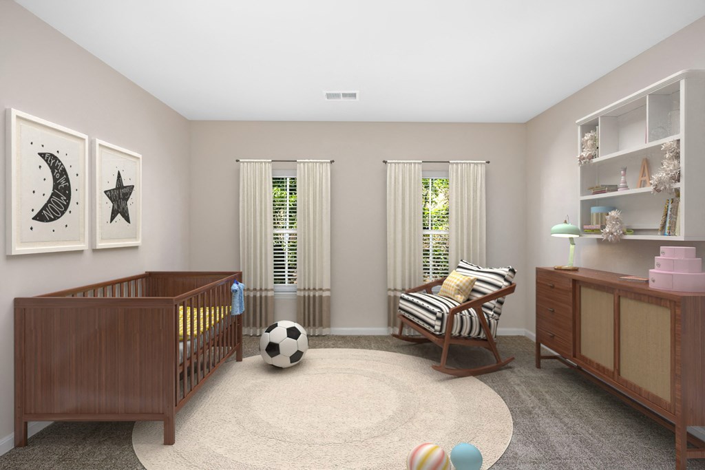 a nursery with a crib and a rocking chair
