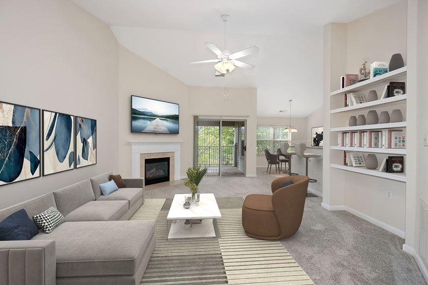 a living room with a gray couch and a white coffee table