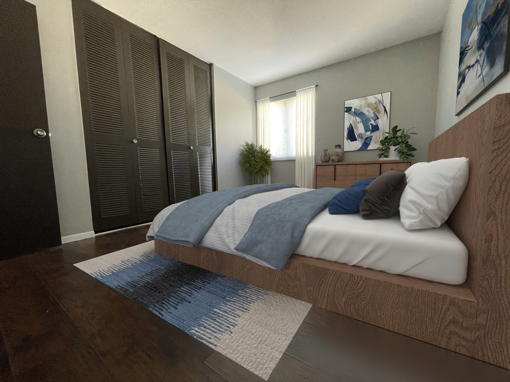 a bedroom with a bed and a rug in front of a window