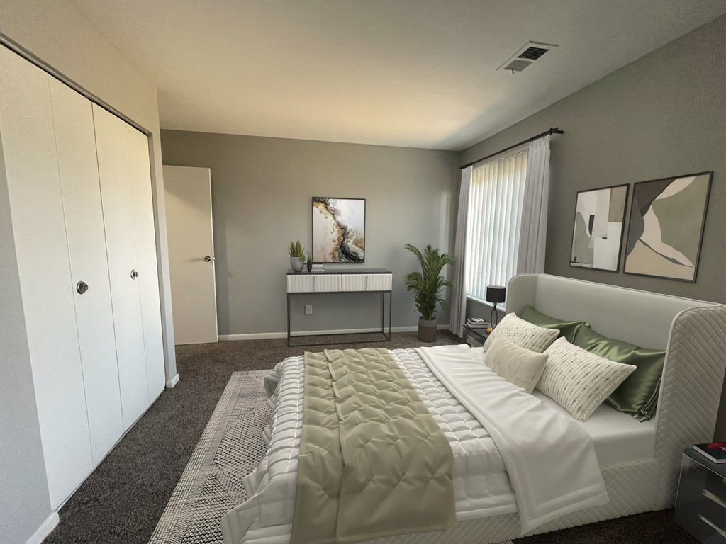 a bedroom with grey walls and a white bed