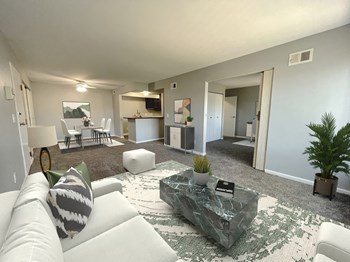 a living room with gray walls and a white couch - Photo Gallery 2