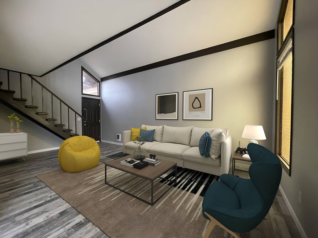 a living room filled with furniture and a large window