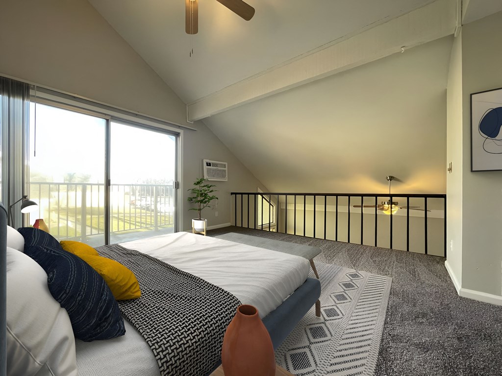 a bedroom with a large bed and a large window