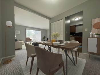 a dining area with a wooden table and chairs and a kitchen in the background - Photo Gallery 13