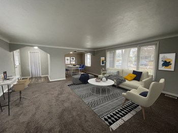 a living room with gray walls and a white coffee table in the middle of the room - Photo Gallery 6