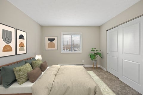 a bedroom with a large bed and a potted plant in the corner of the room