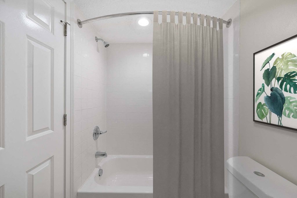 a bathroom with a shower and a toilet at Harpers Point Apartments, Cincinnati, 45249