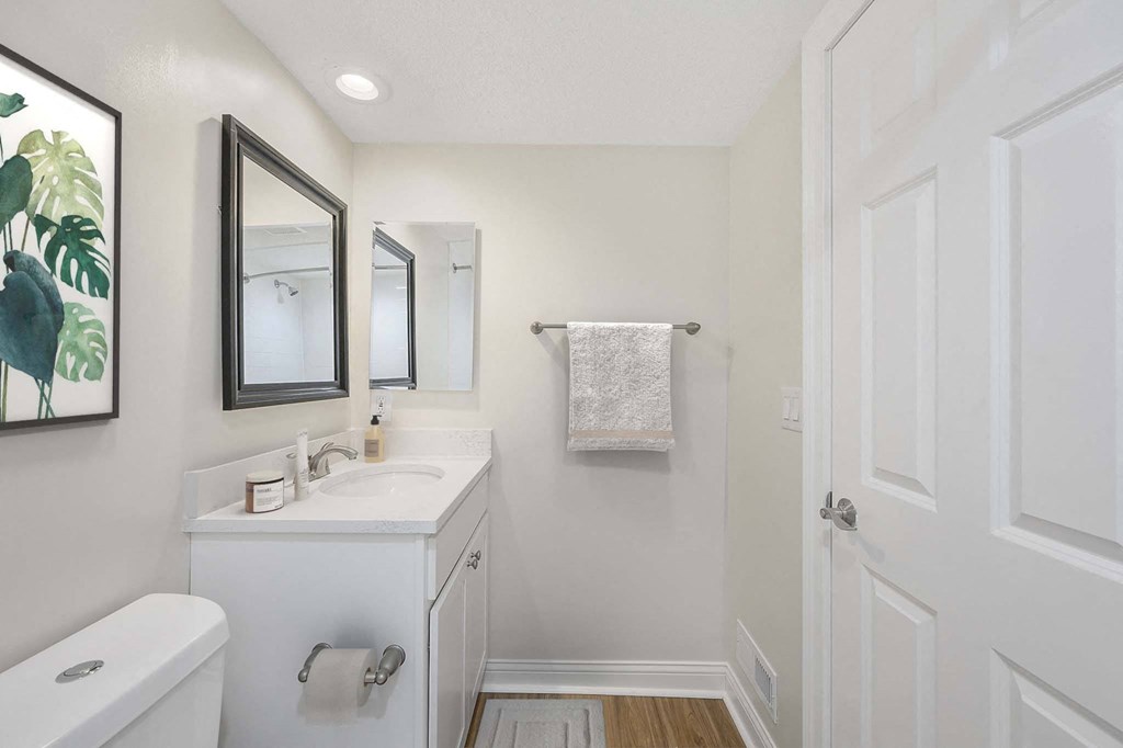 a bathroom with a sink and a mirror at Harpers Point Apartments, Cincinnati, Ohio
