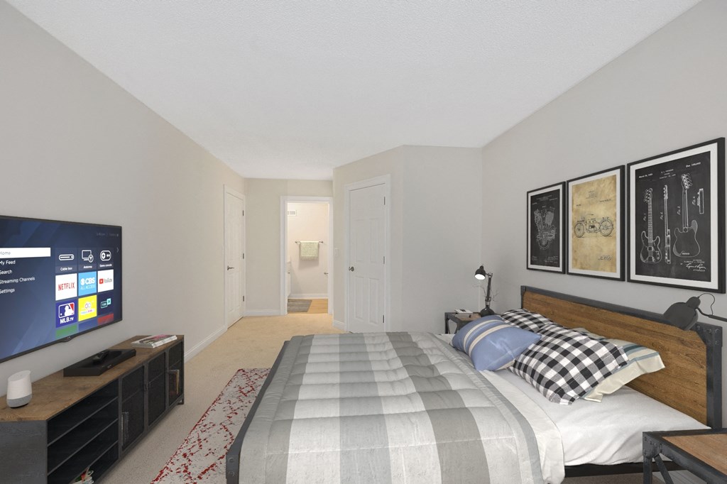 a bedroom with a bed and a television at Harpers Point Apartments, Ohio, 45249