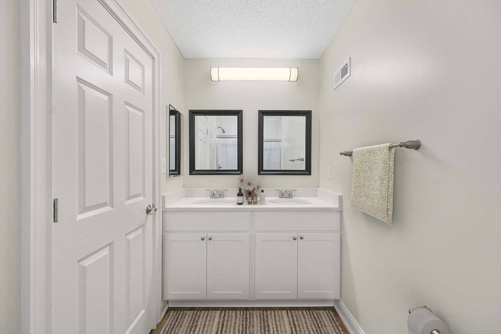 a bathroom with a sink and a mirror at Harpers Point Apartments, Cincinnati, OH, 45249