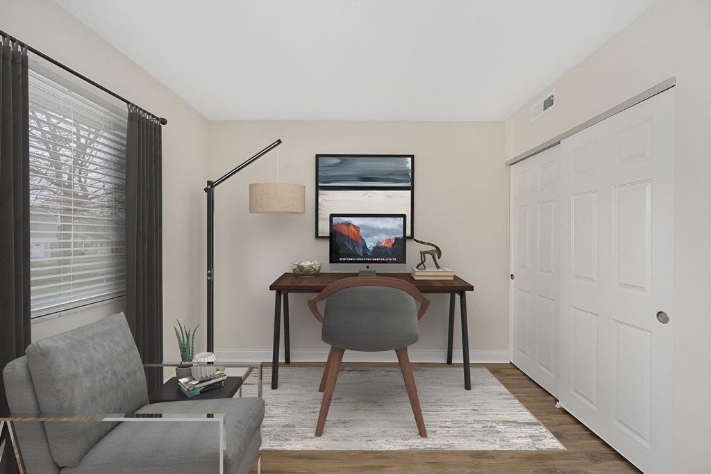 a home office with a computer desk and chair at Harpers Point Apartments, Cincinnati